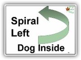 26. Spiral Left   Dog Inside. Performed as in Station 25, except that the turns of the spiral are to the handler’s left (counter-clockwise) and the dog is on the inside of the turns. 

