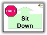 3. HALT   Sit   Down.  While heeling, the handler comes to a halt and the dog sits in heel position. The handler then cues the dog to lie down. When the dog is down, the handler resumes a proper heel position, then cues the dog to heel forward from the down.
General Note about the DOWN: In all Rally-O stations where the dog is required to down, if the dog lies decidedly crookedly (see sit) or rolls around, there will be minor deductions (1 - 2 points) depending on the degree of crookedness and /or movement.  
